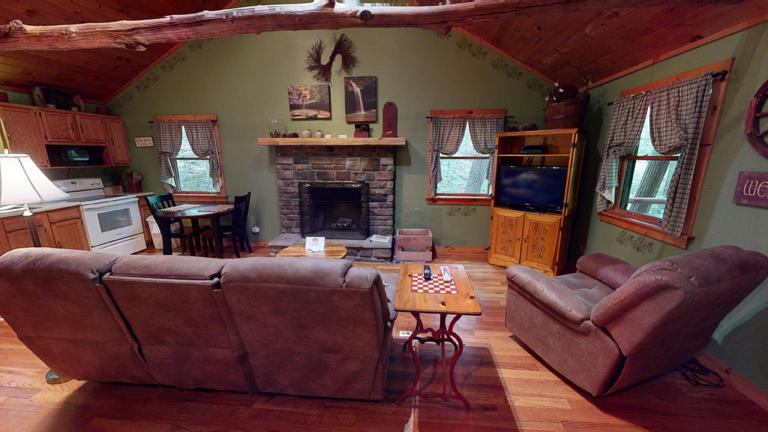 hocking hills cabins sweet seclusion couch in front of fireplace